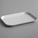 A white rectangular Cambro market tray with a handle.