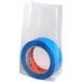 A roll of blue tape in a clear Choice gusseted polyethylene bag.