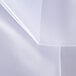 A close-up of a white sheet covering a surface.