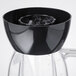 A black Waring blender jar lid with a black center.