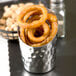 An American Metalcraft stainless steel French fry cup filled with fried onion rings.