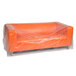A clear plastic furniture bag covering an orange couch.
