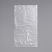A clear plastic bag with a crease on a white background.