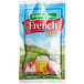 A blue and white bag of Hidden Valley Fat Free French Dressing with Honey Packets on a white surface.