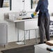 a white sink under a white counter