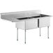 A Regency stainless steel two compartment sink with a left drainboard.
