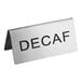A close-up of a silver stainless steel table tent sign that says "Decaf" on both sides.
