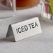 A double sided stainless steel table tent sign that says "Iced Tea" on it.