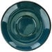 A close-up of a International Tableware Luna midnight blue porcelain saucer with a small rim and a blue circle.