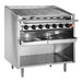 A Bakers Pride stainless steel floor model charbroiler with four burners.