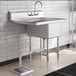 A Regency stainless steel one compartment sink with a left drainboard.