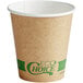 a brown paper cup with green text