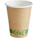 a brown paper cup with green label