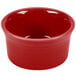 A red Fiesta ramekin with a white background.