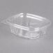 A clear Genpak plastic container with a lid.