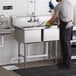 a person putting a container into a sink