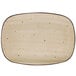 A white rectangular porcelain platter with black dots.