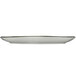 A white rectangular porcelain platter with a green rim.