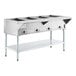 A four-pan open well electric steam table with an adjustable undershelf.