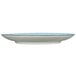 An International Tableware Rotana porcelain plate with a blue rim and white center.