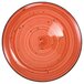 An International Tableware Ruby Coupe porcelain plate with black specks.