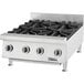 A stainless steel Garland countertop gas range with eight burners and black knobs.
