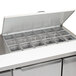 A stainless steel Continental Refrigerator sandwich prep table with open lid.