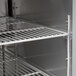 A metal shelf inside a Continental Refrigerator Mighty Top Sandwich Prep Table.