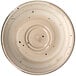 A close-up of a white porcelain saucer with black dots on it.