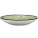 A close up of a lime green International Tableware Rotana pasta bowl with a rim.
