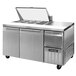A stainless steel Continental Refrigerator with two doors and a top.