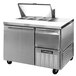 A Continental Refrigerator stainless steel sandwich prep table with one full door and one half door.