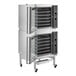 A double deck full size electric digital convection oven with steam injection and casters.