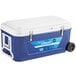 A blue and white Choice cooler with wheels and tow handle.