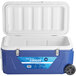A blue and white Choice cooler with wheels.