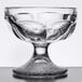 A clear glass Libbey sherbet bowl with a base and a small design.