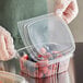 plastic containers with fruit in them