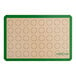 A green and white Baker's Lane baking mat with circles for 2" macarons.