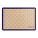 A purple Baker's Lane silicone baking mat with circles for macarons.