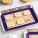 Baker's Lane purple silicone baking mat with cookies on a tray.