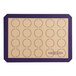 A Baker's Lane purple silicone baking mat with circles for macarons.