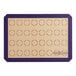 A Baker's Lane purple silicone baking mat with circles for 32 macarons.