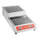 A stainless steel double countertop step-up induction range with digital controls and two cooking surfaces.