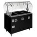 A black food warmer with a solid base and clear covers over two containers.