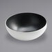 An American Metalcraft white melamine bowl with a black speckled rim.