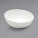 An American Metalcraft white melamine bowl on a gray surface.