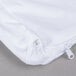 A close up of a JT Eaton white box spring encasement with a zipper.