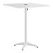 A white, square, bar-height outdoor table with a central umbrella hole and a four-legged base.
