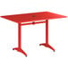 A Lancaster Table & Seating red rectangular table with metal legs.