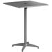 A Lancaster Table & Seating gray powder-coated aluminum bar height table with a metal surface and base.